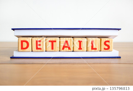 Details detail symbol. Concept word Details on beautiful wooden blocks in book. Beautiful wooden table white background. Business details concept. Copy space. Details detail symbol. Concept word Details on beautiful wooden blocks in book. Beautiful wooden table white background. Business details concept. Copy space. 135796813