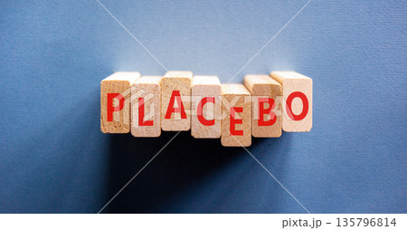 Placebo word medical symbol. Concept word Placebo on beautiful wooden blocks. Beautiful blue background. Business placebo word medical concept. Copy space. Placebo word medical symbol. Concept word Placebo on beautiful wooden blocks. Beautiful blue background. Business placebo word medical concept. Copy space. 135796814