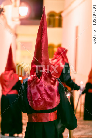 Back view of a nazareno in a holy week procession 135797098