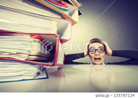 Accountant terrified of pils of binders. 135797124