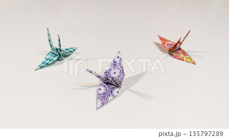 Three paper cranes origami isolated on white background. Traditional Japanese culture. Paper sculpture through folding 135797289