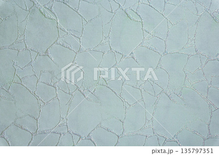 Ice blue textile texture with silver mosaic web pattern 135797351