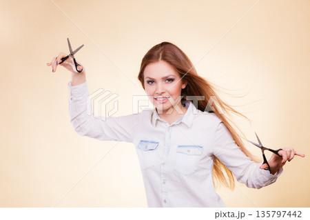 Passionate female hairdresser. Passionate female hairdresser. 135797442