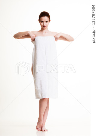 Naked woman in towel after bath Naked woman in towel after bath 135797604