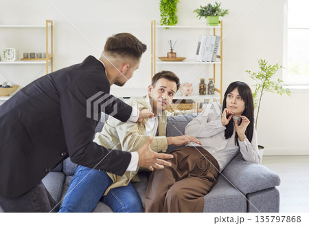 Love triangle confrontation with jealous man exposing betrayal and infidelity Love triangle confrontation with jealous man exposing betrayal and infidelity 135797868
