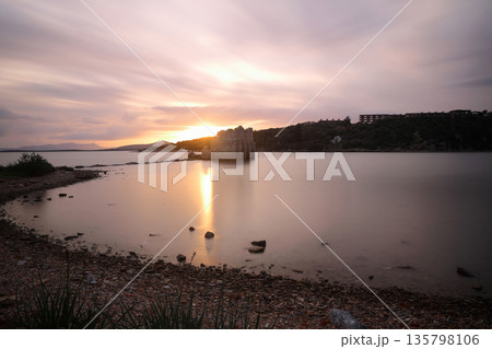Ruined and restored castle at Iasos Turkey on the Aegean Sea near Bodrum. Long Exposure shoot. tranquility scene. Ruined and restored castle at Iasos Turkey on the Aegean Sea near Bodrum. Long Exposure shoot. tranquility scene. 135798106
