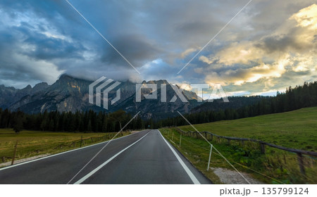 A scenic road in the Italian Alps. Hiking trails in the Dolomite Alps. High quality photo A scenic road in the Italian Alps. Hiking trails in the Dolomite Alps. High quality photo 135799124