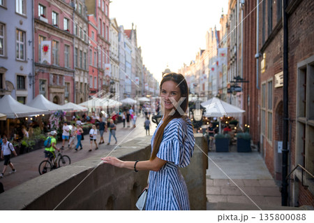 Woman on bridge above Old Town street market in Gdansk Poland 135800088
