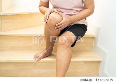 Asian lady woman patient fall down the stairs because slippery surfaces. Asian lady woman patient fall down the stairs because slippery surfaces. 135802819