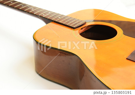 brown wood acoustic guitar isolated on white background 135803191