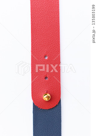 dark blue and red leather strap isolated on white background 135803199