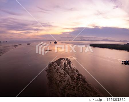 Beautiful Light Sunset or sunrise over sea,Colorful sunset Sky with Amazing clouds and waves cloud background Beautiful Light Sunset or sunrise over sea,Colorful sunset Sky with Amazing clouds and waves cloud background 135803282