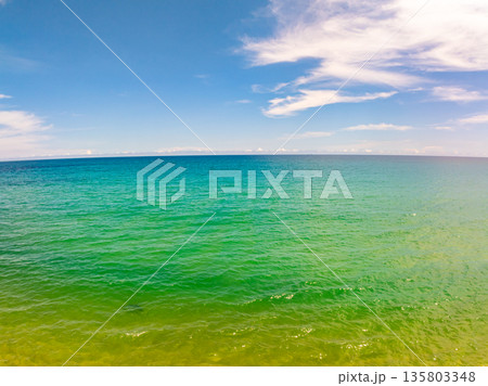 Beautiful sea in summer season blue sky white cloud background Beautiful sea in summer season blue sky white cloud background 135803348