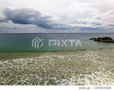 Dark clouds over sea nature beach background Dark clouds over sea nature beach background 135803369