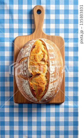 Sourdough Bread on Gingham Tablecloth 135803831