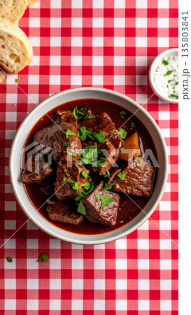 Beef Stew in Red Wine on Gingham Tablecloth 135803841