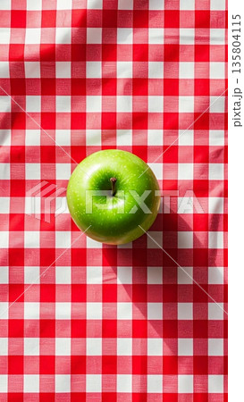 Green Apple on Red Gingham Tablecloth 135804115