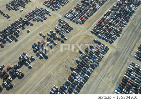 View from above of big parking lot with parked used cars after accident ready for sale. Auction reseller company selling secondhand broken vehicles for repair View from above of big parking lot with parked used cars after accident ready for sale. Auction reseller company selling secondhand broken vehicles for repair 135804910