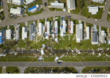 Severely damaged houses after hurricane Ian in Florida mobile home residential area. Consequences of natural disaster Severely damaged houses after hurricane Ian in Florida mobile home residential area. Consequences of natural disaster 135804912