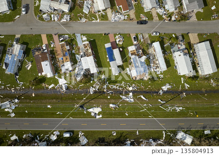 Badly damaged mobile homes after hurricane Ian in Florida residential area. Consequences of natural disaster 135804913