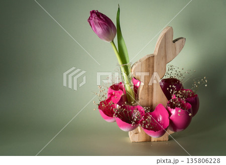 Easter holiday decoration from sustainable materials pink colored egg shell wooden bunny vase decor with fresh tulip flower. Copy space Diy do it yourself Gift present idea. Zero waste Crafting Easter holiday decoration from sustainable materials pink colored egg shell wooden bunny vase decor with fresh tulip flower. Copy space Diy do it yourself Gift present idea. Zero waste Crafting 135806228