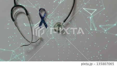 Displaying silver stethoscope and navy blue ribbon on gray table with global data network overlay Displaying silver stethoscope and navy blue ribbon on gray table with global data network overlay 135807065