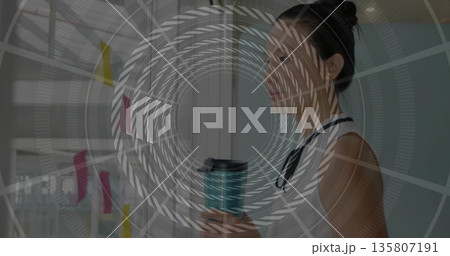 Holding teal mug woman wearing blouse reading partition sticky notes in office corridor, copy space 135807191