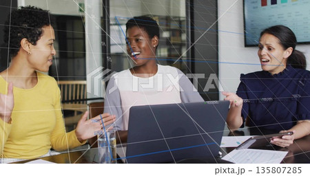 Discussing colleagues exchanging ideas in office with devices water glass, documents and bar charts 135807285