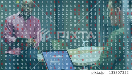 Standing colleagues holding tablet and smartphone in office meeting room, with binary code overlay Standing colleagues holding tablet and smartphone in office meeting room, with binary code overlay 135807332
