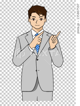 A young businessman in a suit explaining by pointing to the left with both hands (upper body) 135807597