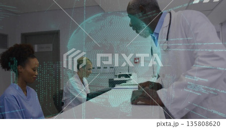 Leaning senior physician guiding nursing staff at clinic reception, with digital globe projection Leaning senior physician guiding nursing staff at clinic reception, with digital globe projection 135808620