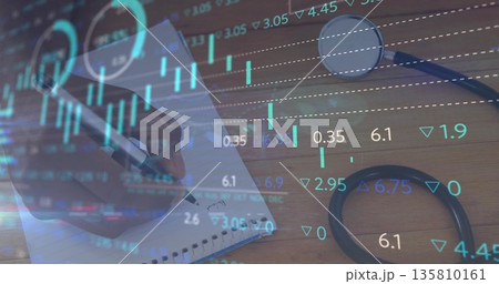 Showing male hand writing notes in spiral notebook on office desk, stethoscope and magnifying glass 135810161