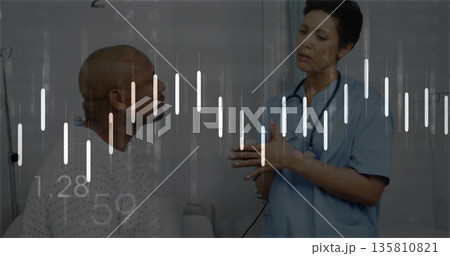 Sitting patient on hospital bed listening to nurse gesturing, with stethoscope and bar charts 135810821