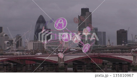 Floating translucent network sphere hovering over London riverside, with red bridge and skyline Floating translucent network sphere hovering over London riverside, with red bridge and skyline 135810967