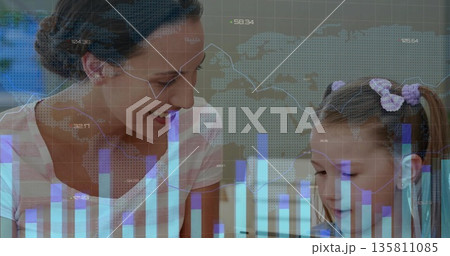 Smiling mother guiding daughter writing workbook at home study desk, with data overlay, copy space 135811085