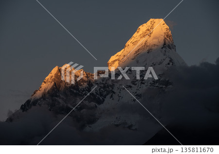 Beautiful view of Mt.Ama Dablam (6,812 m) at sunset seen from Khumjung village, Nepal. Ama Dablam is one of the most beautiful mountains in the world. Beautiful view of Mt.Ama Dablam (6,812 m) at sunset seen from Khumjung village, Nepal. Ama Dablam is one of the most beautiful mountains in the world. 135811670