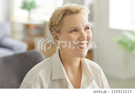 Portrait Of A Smiling Elderly Woman Relaxing At Home Portrait Of A Smiling Elderly Woman Relaxing At Home 135813213