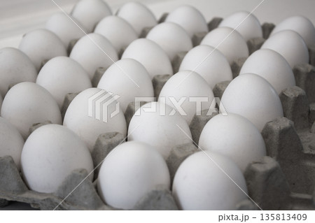 These are white eggs in an egg carton. These are white eggs in an egg carton. 135813409