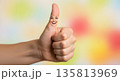 Hand giving thumbs up with colorful abstract background 135813969