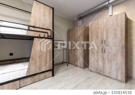 Hostel dormitory with private bunk beds and large wooden lockers Hostel dormitory with private bunk beds and large wooden lockers 135814510