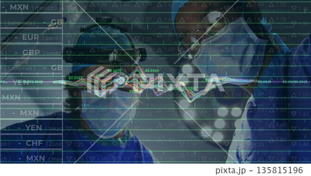 Standing two surgeons wearing scrubs caps goggles masks under lights in OR, with financial overlay 135815196