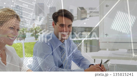 Smiling man in suit analyzing data overlays at glass-topped conference table in high-rise office Smiling man in suit analyzing data overlays at glass-topped conference table in high-rise office 135815241