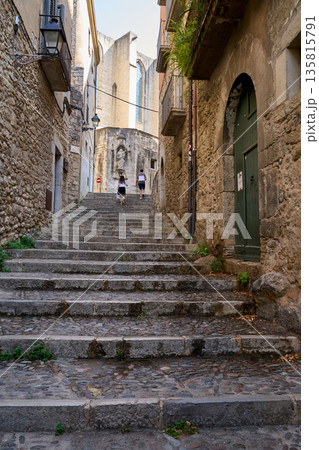 A Medieval street with stairs in the city of Girona, Catalonia, Spain.  135815791