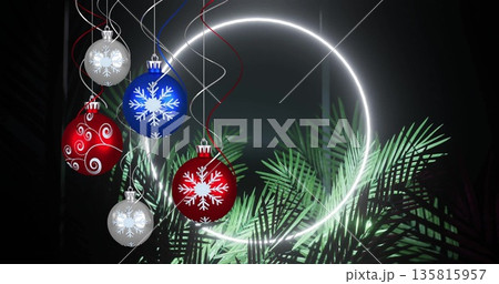 Image of neon circle and leaves over christmas baubles 135815957
