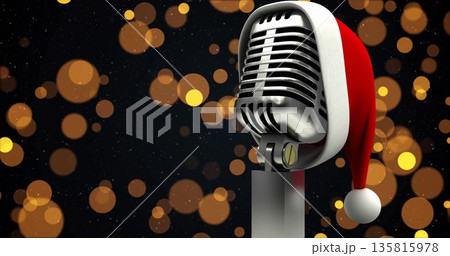 Image of yellow spots over microphone with santa hat 135815978