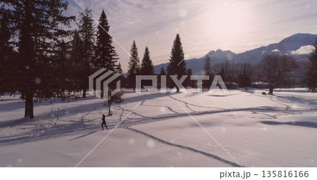 Image of christmas winter scenery with person running in countryside Image of christmas winter scenery with person running in countryside 135816166