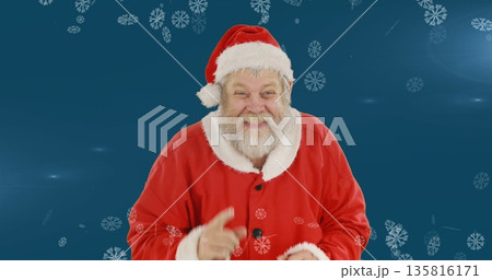 Image of santa claus smiling over winter scenery with snow falling on blue background 135816171