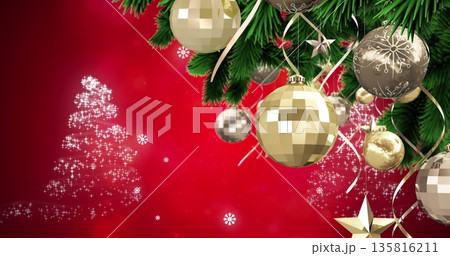 Image of snow falling over christmas decoration with baubles Image of snow falling over christmas decoration with baubles 135816211