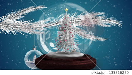 Image of snow falling over christmas snow ball Image of snow falling over christmas snow ball 135816280