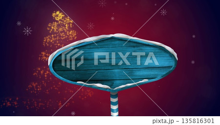 Image of snow falling over blue signpost 135816301